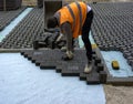 Construction worker laying interlocking paving concrete Royalty Free Stock Photo