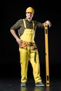Construction worker with level tool Royalty Free Stock Photo