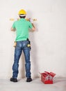 Construction worker with level tool Royalty Free Stock Photo