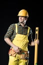 Construction worker with level tool Royalty Free Stock Photo