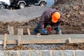 construction worker leveling concrete pavement outdoors Royalty Free Stock Photo