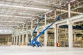 Construction worker is lifted by a boom lift