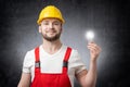 Construction worker with light bulb Royalty Free Stock Photo