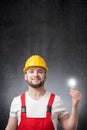 Construction worker with a light bulb Royalty Free Stock Photo