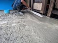 Construction worker in liquid concrete