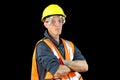 Construction worker male in yellow safety hat, orange vest, red gloves, googles and getting ready to work. Royalty Free Stock Photo