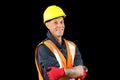 Construction worker male in yellow safety hat, orange vest, red gloves, googles and getting ready to work. Royalty Free Stock Photo