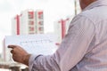 A construction worker man holding in hands blueprints Royalty Free Stock Photo