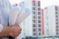 A construction worker man holding in hands blueprints Royalty Free Stock Photo