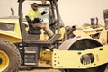 construction worker man used construction heavy machine equipment on building industry site for roadwork outdoor Royalty Free Stock Photo