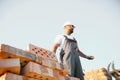 Indian Construction worker man in work clothes and a construction helmet. Portrait of positive male builder in hardhat Royalty Free Stock Photo