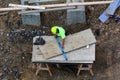 Construction worker measure piece of wood with ruler