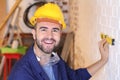 Construction worker measuring the correct level with tool