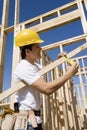 Construction Worker Measuring Timber Royalty Free Stock Photo