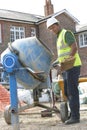 Construction Worker Mixing Cement