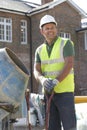 Construction Worker Mixing Cement