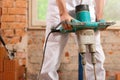 Construction worker mixing concrete