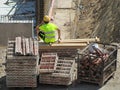 Construction worker in the construction of modern residential buildings. A worker calling from a mobile phone.