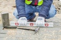 Construction worker near unfinished pavement