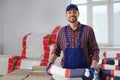 Construction worker with new building materials in room prepared for renovation Royalty Free Stock Photo