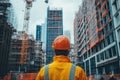 Construction worker observing construction site for project management and planning activities Royalty Free Stock Photo