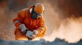 Construction worker in orange safety gear uses power tool amidst dust, showcasing focus and determination Royalty Free Stock Photo