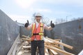 Construction Worker outside of house put old renovation material on big conteiner Royalty Free Stock Photo
