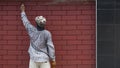 Construction worker is painting to renovate the old block wall outside of house building Royalty Free Stock Photo