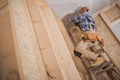 Construction Worker Performing Ceiling Installation