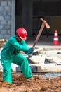 Construction worker performs the construction of the factory shed Royalty Free Stock Photo