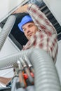 Construction worker placing pipe Royalty Free Stock Photo