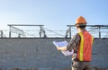 A construction worker plan checking Construction site area During working hours Royalty Free Stock Photo