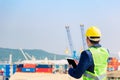 Construction Worker Planning Contractor Checking  at Logistics and transportation of International Container Cargo Royalty Free Stock Photo