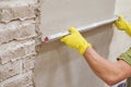 Construction worker plastering and smoothing concrete wall Royalty Free Stock Photo
