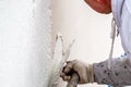 Construction worker plastering and smoothing concrete wall with cement Royalty Free Stock Photo