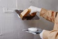 Construction worker plastering and smoothing wall Royalty Free Stock Photo