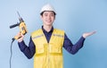 Construction worker portrait on blue background Royalty Free Stock Photo