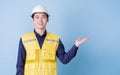 Construction worker portrait on blue background Royalty Free Stock Photo