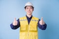 Construction worker portrait on blue background Royalty Free Stock Photo