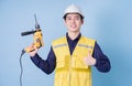 Construction worker portrait on blue background Royalty Free Stock Photo