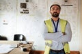 Construction worker, portrait and man with arms crossed in office or building site for architecture project. Architect Royalty Free Stock Photo