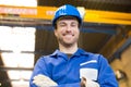 Construction worker posing in front of crane Royalty Free Stock Photo