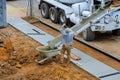 Construction worker pour cement for sidewalk in concrete works with mixer truck with wheelbarrow Royalty Free Stock Photo