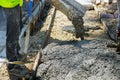Construction worker pour cement for sidewalk in truck mixer pouring concrete cement for construction sidewalk Royalty Free Stock Photo