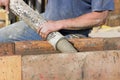 Construction worker pouring cement foundation