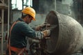 Construction worker pouring concrete at a building site during the day Royalty Free Stock Photo