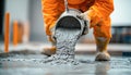 Construction worker pouring concrete on building site Royalty Free Stock Photo