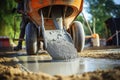 Construction worker pours ready-mix concrete from a cement mixer truck. Royalty Free Stock Photo
