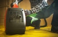 Construction Worker Preparing Gasoline Electricity Generator To Work Royalty Free Stock Photo