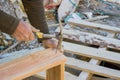 Construction worker preparing wooden formwork